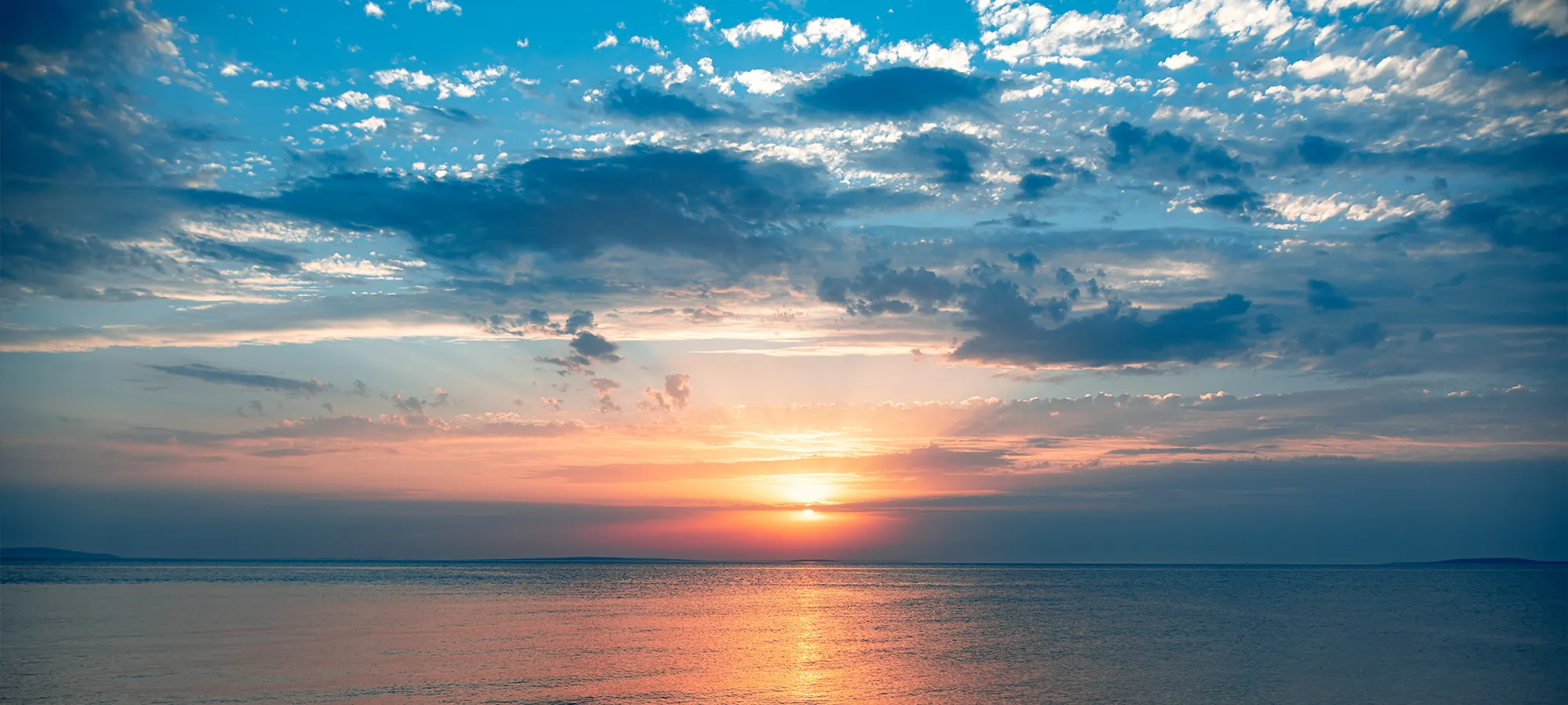 Sun Setting Over The Ocean