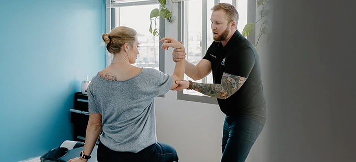 Chiropractor Adam Greenberg With Myofascial Release Patient