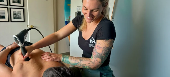 Chiropractor Jenna Swaffer With Shockwave Patient